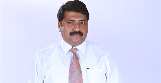 Dr. Kiran R